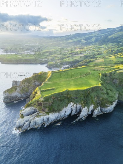 Cape Furado, Cliffs, Hills, Green Lush Fields, Pasturelands and Atlantic Ocean on Sunny Morning. Azores, Sao Miguel Island. Portugal. Aerial View