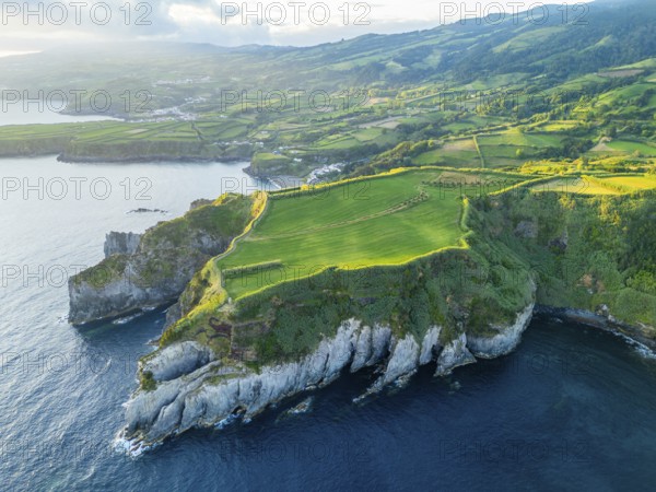 Cape Furado, Cliffs, Green Lush Fields, Pasturelands and Atlantic Ocean on Sunny Morning. Azores, Sao Miguel Island. Portugal. Aerial View