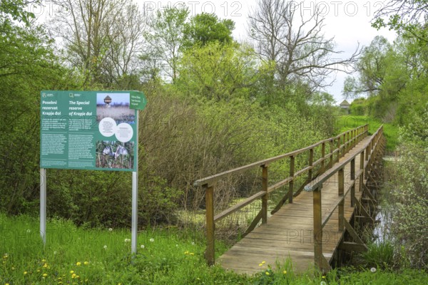 Information board and wooden bridge into the Krapje Dol nature reserve, Krapje, Sisak-Moslavina County, Croatia