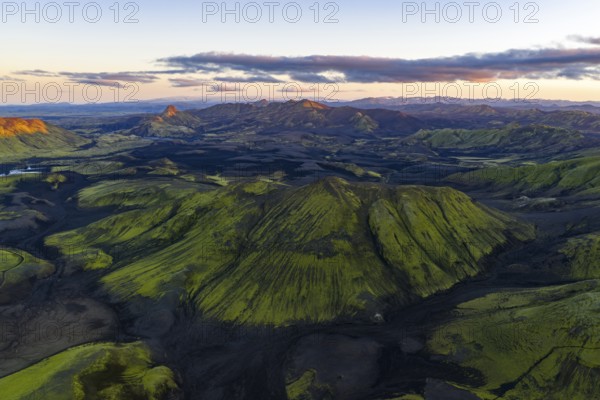 Moss-covered landscape with mountains in the Icelandic Highlands, Iceland