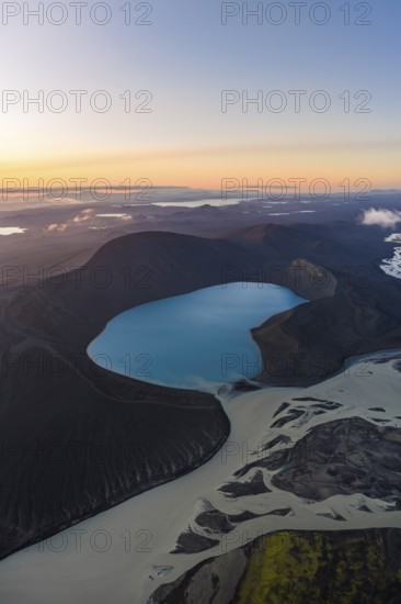 Turquoise crater lake Skyggnisvatn and glacial river, Icelandic Highlands, Iceland