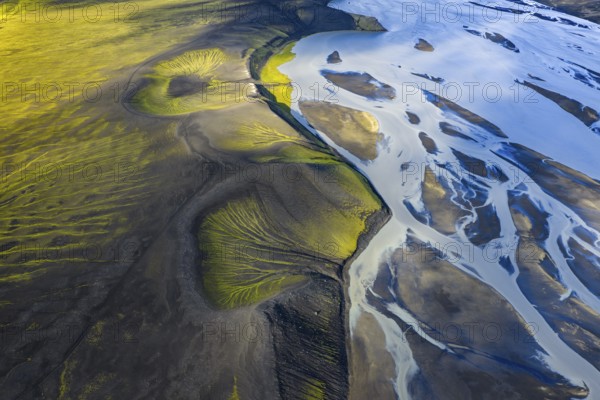 Abstract patterns of moss in black sand, riverbed, Icelandic Highlands, Iceland