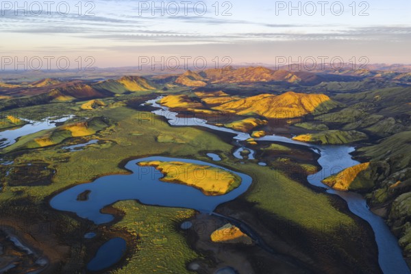Mossy landscape and lakes at sunrise, Icelandic Highlands, Iceland