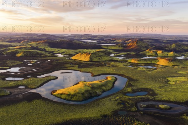 Mossy landscape and lakes at sunrise, Icelandic Highlands, Iceland