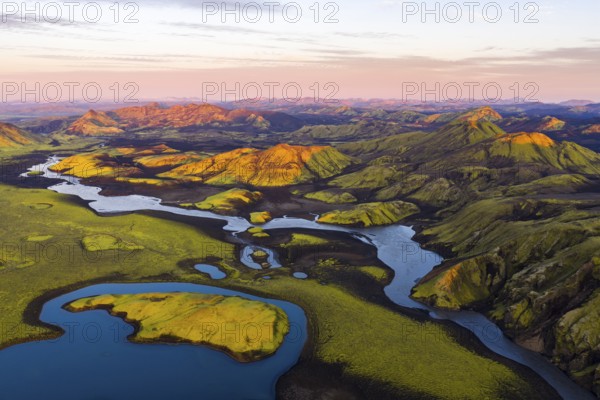 Mossy landscape and lakes at sunrise, Icelandic Highlands, Iceland