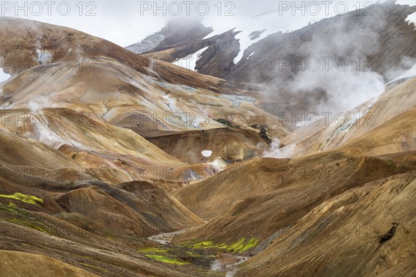 Steaming springs and colourful rhyolite mountains, Hveradalir geothermal area, Kerlingarfjöll, Icelandic Highlands, Iceland