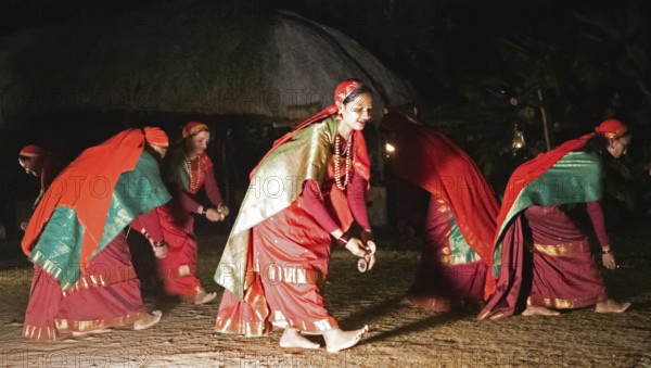Kodava woman in traditional dress dancing in the evening, blurred, Coorg, Karnataka, India