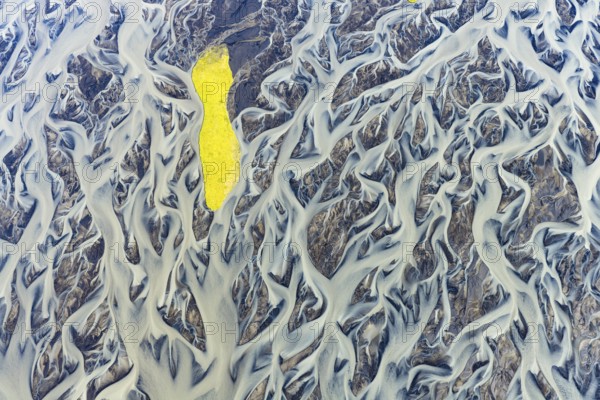 Small island in the branched course of a glacial river, South Iceland, Iceland