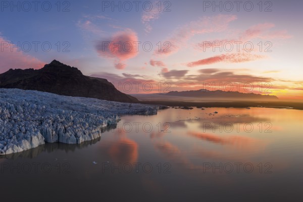 Glacier with Fjallsarlon glacier lagoon at sunrise, Vatnajökull National Park, South Iceland, Iceland