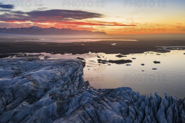 Glacier with Fjallsarlon glacier lagoon at sunrise, Vatnajökull National Park, South Iceland, Iceland