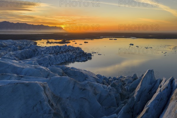 Glacier with Fjallsarlon glacier lagoon at sunrise, Vatnajökull National Park, South Iceland, Iceland