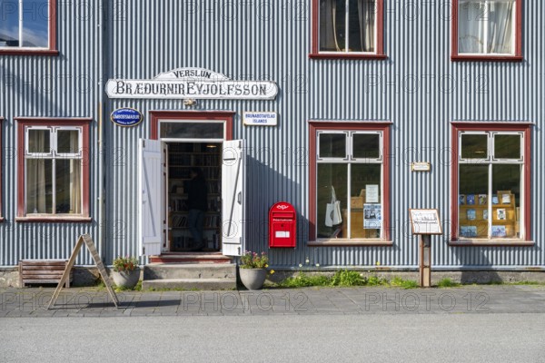 Shop window and entrance of the old bookshop in Flateyri, Westfjords, West Iceland, Iceland