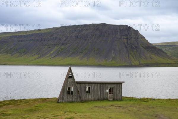 Old abandoned house by the fjord, Westfjords, West Iceland, Iceland