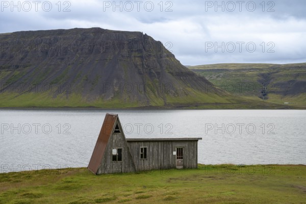Old abandoned house by the fjord, Westfjords, West Iceland, Iceland
