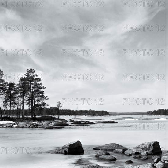 Lake Stora Gla in winter, frozen, with rocks and islands, black and white, analogue, Värmland, Sweden