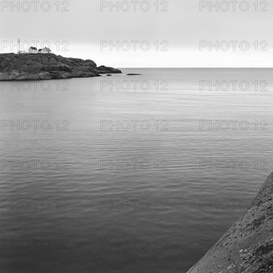 North Sea, Skagerrak, behind a rock with lonely white houses, black and white, analogue, Bohuslän, Västra Götaland, Sweden