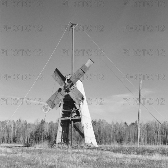 Old broken windmill in a field, black and white, analogue, Tysslingen, Örebro, Sweden