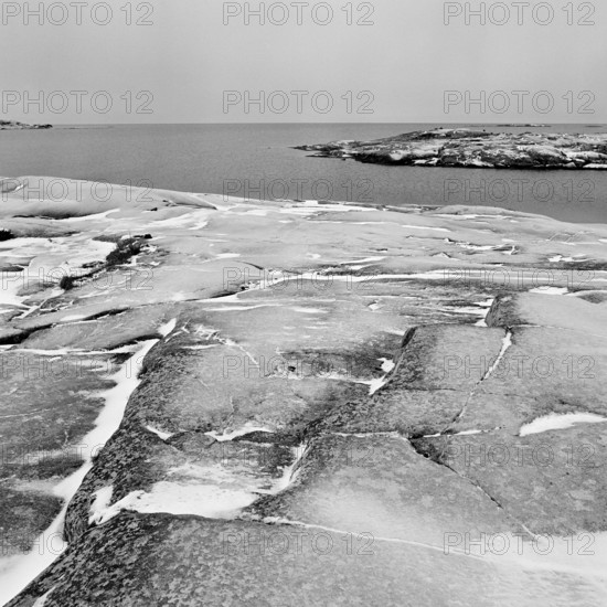 Rocky landscape without vegetation by the sea, North Sea, Skagerrak, in the nature reserve Ramsvikslandet, winter, black and white, analogue, Bohuslän, Västra Götaland, Sweden