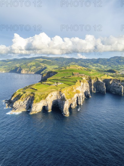 Cape Cintrao, Cliffs, Green Lush Hills, Fields, Pasturelands and Atlantic Ocean. Azores, Sao Miguel Island. Portugal. Aerial View