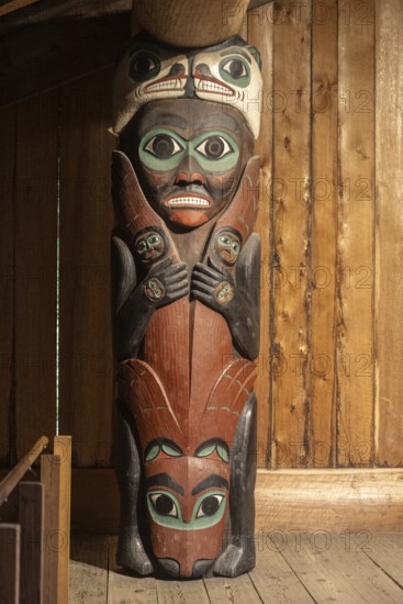 Totem poles in a Tlingit Clan House, Totem Bight State Historical Park, Ketchikan, Alaska, USA