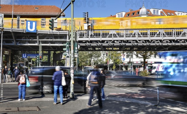 Street scene at Schlesisches Tor underground station, yellow underground train on elevated railway, Berlin, 02.10.2025, Berlin, Berlin, Germany