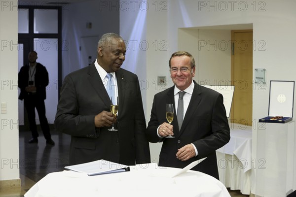 Federal Minister of Defence Boris Pistorius with Lloyd James Austin III former United States Secretary of Defence 2021 to 2025 at the champagne reception - Award of the Order of Merit of the Federal Republic of Germany to Lloyd James Austin III in recognition of his personal commitment to strengthening German-American friendship and bilateral defence and military policy cooperation at the Federal Ministry of Defence, Berlin, 01.10.25