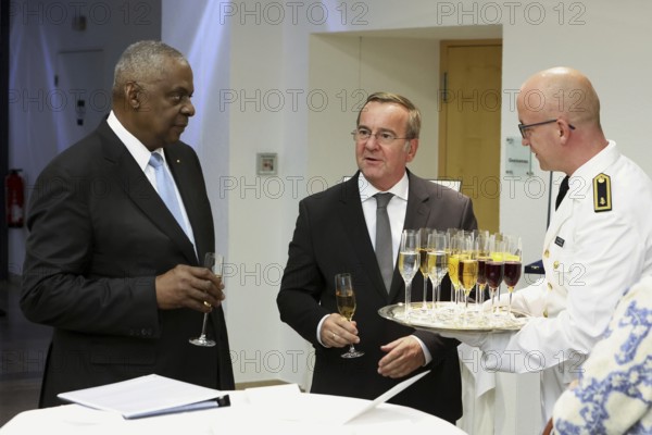 Federal Minister of Defence Boris Pistorius with Lloyd James Austin III former United States Secretary of Defence 2021 to 2025 at the champagne reception - Award of the Order of Merit of the Federal Republic of Germany to Lloyd James Austin III in recognition of his personal commitment to strengthening German-American friendship and bilateral defence and military policy cooperation at the Federal Ministry of Defence, Berlin, 01.10.25