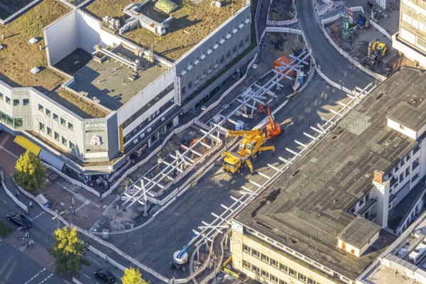 Aerial view, construction site Westentor am City-Center, federal road 63 Westring, centre, Hamm, Ruhr area, North Rhine-Westphalia, Germany, workplace, architecture, view, cars, construction, construction work, construction area, construction site, building plots, construction project, construction projects, construction site, federal road 63, City-Center, DE, development, renewal, Europe, progress, building, commercial, commercial area, infrastructure, engineering, construction, crane, aerial view, aerial photography, aerial photography, machinery, modernisation, city view, city centre, road construction, overview, traffic, bird's eye view, Westentor, Westring, clouds, birds-eyes view, overview, urban