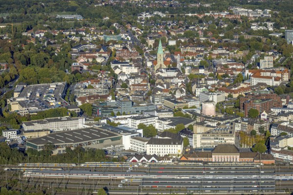 Aerial view, city centre view with evang. St. Paul's Church, city festival with Ferris wheel, platforms of the main station, centre, Hamm, Ruhr area, North Rhine-Westphalia, Germany, place of worship, railway area, station, platform, DE, Deutsche Bahn AG, Europe, religious community, railway tracks, tracks, house of God, main station, main station, holy place, church, church community, denomination, aerial view, aerial photography, aerial photography, religion, religious site, overview, bird's eye view, birds-eyes view, overview