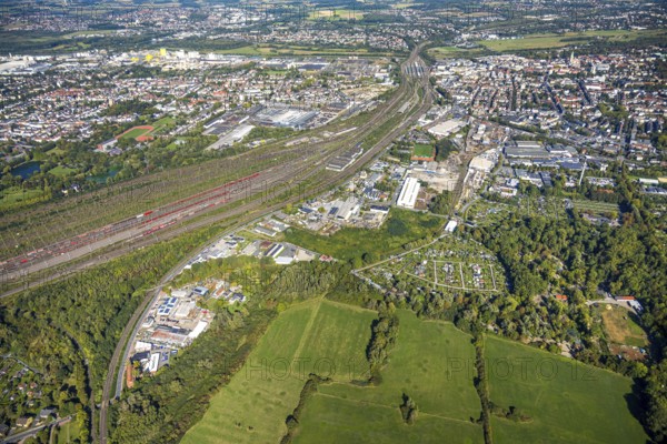 Aerial view, marshalling yard Hamm, industrial area Östingstraße, view to the harbour, railway station Hbf and to the city centre, KGV allotment garden association Bahn-Landwirtschaft Essen e.V. and zoo, transmitter Hamm telecommunication tower, district Pelkum, Hamm, Ruhr area, North Rhine-Westphalia, Germany, DE, Europe, commercial enterprise, commercial space, commercial area, commercial property, commercial site, commercial use, railway tracks, railway tracks, goods trains, industrial area, industrial site, aerial view, aerial photography, aerial photography, overview, bird's-eye view, birds-eyes view, overview