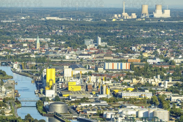 Aerial view, harbour with Voestalpine Boeler and view to the city with St. Paul's Church, behind the RWE power plant Westfalen, district Herringen, Hamm, Ruhr area, North Rhine-Westphalia, Germany, place of worship, DE, Europe, religious community, place of worship, harbour, harbour area, harbour area, holy place, church, parish, denomination, aerial view, aerial photography, aerial photography, religion, religious site, overview, bird's eye view, birds-eyes view, overview