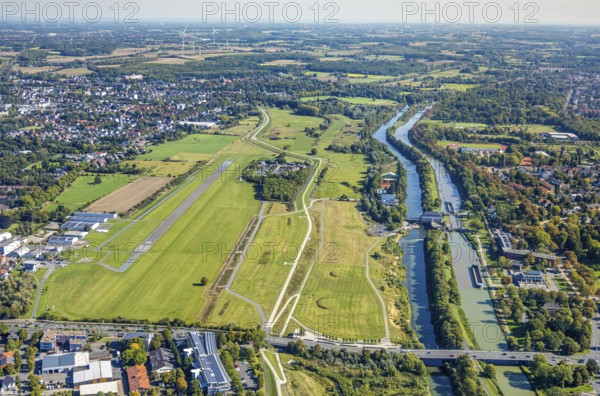 Aerial photograph, Hamm-Lippewiesen airfield and the Datteln-Hamm canal and Lippe river experience area, Hamm Mattenbecke sewage treatment plant and Hamm lock, Heessen district, Hamm, Ruhr area, North Rhine-Westphalia, Germany, DE, Europe, flight emission, airport, aircraft noise, airfield, sewage treatment plant, runway, aerial photograph, aerial photography, aerial photography, lock, runway, overview, bird's-eye view, bird's-eye view, overview