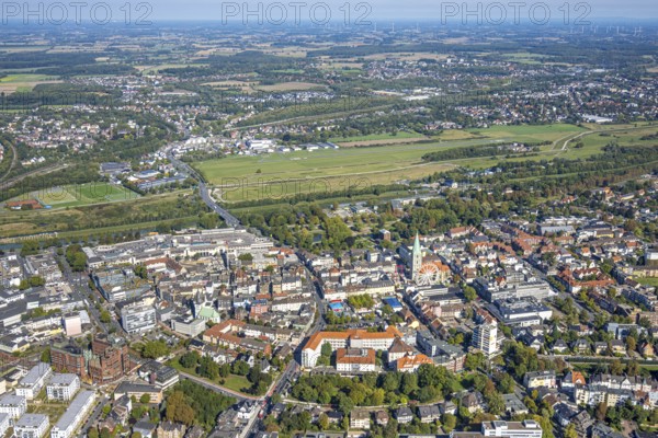 Aerial view, experience space, Hamm-Lippewiesen airfield and city centre with evang. Pauluskirche and city festival with Ferris wheel, Allee-Center and Johanniter-Kliniken Hamm location Nassauerstraße, distant view, centre, Hamm, Ruhr area, North Rhine-Westphalia, Germany, place of worship, DE, shopping centre, shopping place, shopping mall, Europe, festival, health care, religious community, place of worship, holy place, hospital, church, parish, clinic, clinic centre, denomination, infirmary, hospital, aerial view, aerial photography, aerial photography, medical facility, medical aid, local supply centre, religion, religious site, shopping centre, overview, bird's-eye view, overview, medical care