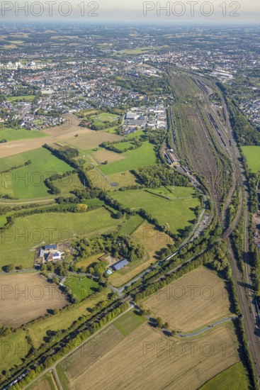 Aerial view, Hamm marshalling yard, Schieferstraße industrial estate with a view of the city centre, Pelkum district, Hamm, Ruhr area, North Rhine-Westphalia, Germany, railway area, DE, Deutsche Bahn AG, Europe, commercial enterprise, commercial area, commercial property, commercial site, commercial use, railway tracks, tracks, property tax, goods trains, real estate, industrial area, industrial site, aerial view, aerial photography, aerial photography, overview, bird's-eye view, residential area, housing and living, residential area, residential quality, residential neighbourhood, housing estate, residential district, birds-eyes view, overview