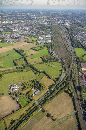 Aerial view, Hamm marshalling yard, Schieferstraße industrial estate with a view of the city centre, Pelkum district, Hamm, Ruhr area, North Rhine-Westphalia, Germany, railway area, DE, Deutsche Bahn AG, Europe, commercial enterprise, commercial area, commercial property, commercial site, commercial use, railway tracks, tracks, property tax, goods trains, real estate, industrial area, industrial site, aerial view, aerial photography, aerial photography, overview, bird's-eye view, residential area, housing and living, residential area, residential quality, residential neighbourhood, housing estate, residential district, birds-eyes view, overview