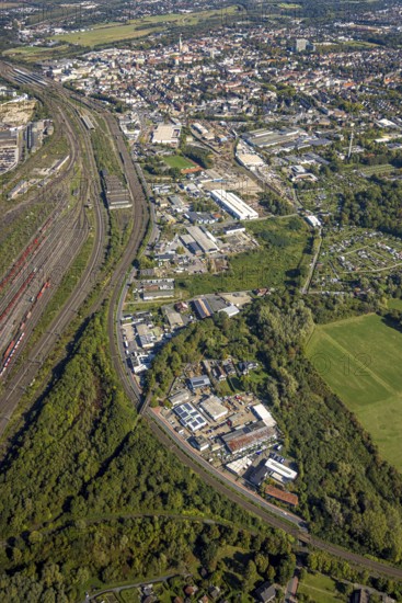 Aerial view, commercial area Östingstraße and view to the main railway station with city centre, transmitter Hamm telecommunication tower, district Pelkum, Hamm, Ruhr area, North Rhine-Westphalia, Germany, railway area, railway station, DE, Deutsche Bahn AG, Europe, commercial enterprise, commercial area, commercial area, commercial property, commercial site, commercial use, railway tracks, tracks, main station, main railway station, industrial area, industrial site, aerial view, aerial photography, aerial photography, tower, overview, bird's-eye view, overview