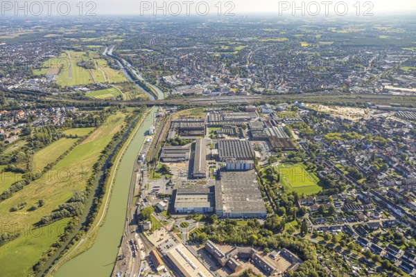 Aerial view, harbour at the Datteln-Hamm canal, industrial area Hafenstraße and Dortmunder Straße, voestalpin Böhler plant, view to the airfield and the city with main station, centre, Hamm, Ruhr area, North Rhine-Westphalia, Germany, DE, Europe, commercial enterprise, commercial area, commercial property, commercial location, commercial use, harbour, harbour area, harbour area, harbour overview, industrial area, industrial location, aerial view, aerial photography, aerial photography, overview, bird's-eye view, overview