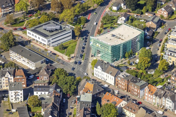 Aerial view, Städtische Musikschule Hamm, covered building and construction site with new building, intersection Ostenallee and Nordring, company building p:os handels GmbH, centre, Hamm, Ruhr area, North Rhine-Westphalia, Germany, construction work, construction area, building site, building plots, construction measure, construction project, building site, DE, Europe, commercial enterprise, commercial space, commercial area, commercial property, commercial site, commercial use, aerial photograph, aerial photography, aerial photography, new building, overview, bird's eye view, birds-eyes view, overview