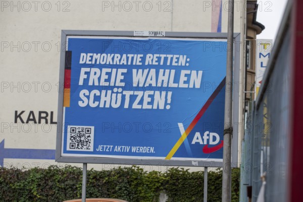 AfD poster in Ludwigshafen with the text DEMOKRATIE RETTEN, FREIE WAHLEN SCHÜTZEN. The city's electoral committee has rejected the candidacy of AfD politician Joachim Paul in the mayoral election in September 2025