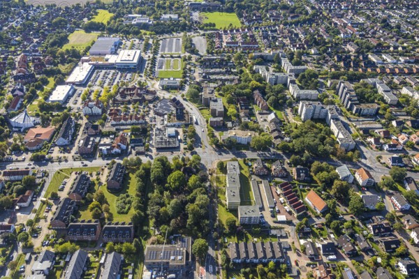 Aerial view, residential area road traffic intersection Ostwennemarstraße and Alter Uentroper Weg, shopping centre with Rewe supermarket, wooded area with Villa Kunterbunt, Uentrop, Hamm, Ruhr area, North Rhine-Westphalia, Germany, DE, Europe, kindergarten, day-care centre, nursery, aerial view, aerial photography, aerial photography, road intersection, road traffic, overview, bird's-eye view, overview