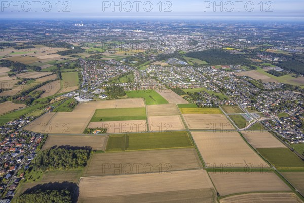 Aerial view, planned stop in Westtünnen, construction site at Südfeldweg and Von-Thünen-Straße for the future railway stop, meadows and fields at Südfeldweg, view to the city, district Rhynern, Hamm, Ruhr area, North Rhine-Westphalia, Germany, railway tracks, railway station, construction work, construction area, construction site, building plots, building crane, building project, building site, city, DE, Deutsche Bahn AG, Europe, large building site, city centre view, aerial view, aerial photography, aerial photography, new building, townscape, town, town view, road tunnel, tunnel, overview, subway, bird's eye view, birds-eyes view, overview