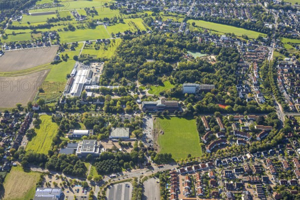 Aerial view, Freiherr-vom-Stein-Gymnasium Hamm with construction site and meadow area, Maximilianpark, Uentrop, Hamm, Ruhr area, North Rhine-Westphalia, Germany, construction work, construction area, construction site, building plots, construction project, construction site, education, educational institution, DE, Europe, grammar school, teaching institute, aerial view, aerial photography, aerial photography, MaxiPark, school, overview, reconstruction, bird's-eye view, Werner-Figgen-Weg, birds-eyes view, overview