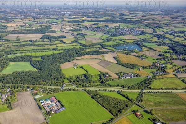 Aerial view, meadows and fields at the Datteln-Hamm canal with bridge Alter Uentroper Weg and old railway bridge Werries, water ski Hamm and district Dolberg, below farm Schweinemast Rörig KG, distant view, Uentrop, Hamm, Ruhr area, North Rhine-Westphalia, Germany, bridge, DE, Europe, canal, aerial view, aerial photography, aerial photography, lake, sport, overview, bird's eye view, water ski facility, birds-eyes view, agricultural areas, overview