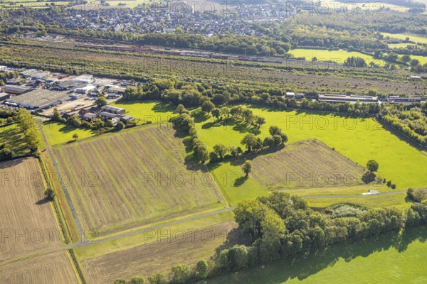 Aerial view, Hamm marshalling yard, Schieferstraße industrial estate, Daberg meadows and fields on Wiescher Bach stream, green trees, Pelkum district, Hamm, Ruhr area, North Rhine-Westphalia, Germany, railway area, DE, Deutsche Bahn AG, Europe, commercial enterprise, commercial area, commercial site, commercial location, commercial use, railway tracks, tracks, property tax, goods trains, real estate, industrial area, industrial site, aerial view, aerial photography, aerial photography, overview, bird's-eye view, residential area, residential area and living, residential quality, residential neighbourhood, residential estate, residential district, birds-eyes view, overview