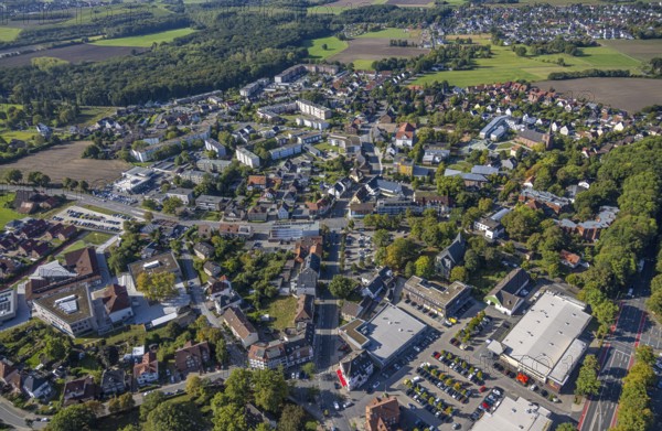 Aerial view, Herringen centre, shopping centre Herringen with supermarket DM, Edeka Weber and Aldi, protestant church Sankt-Viktor-Kirche, in the back Caritas-Altenheim St. Josef and Heilig Kreuz Kirche, Herringen district, Hamm, Ruhr area, North Rhine-Westphalia, Germany, retirement home, old people's home, place of worship, care and nursing, DE, shopping, shopping centre, shopping square, shopping mall, Europe, religious community, place of worship, property tax, holy place, real estate, church, parish, denomination, aerial view, aerial photography, aerial photography, local supply centre, care facility, religion, religious site, retirement home, retirement residence, retirement home, senior citizens' centre, shopping centre, supermarket, overview, bird's-eye view, residential complex, housing and living, residential area, residential quality, residential quarter, housing estate, residential district, birds-eyes view, overview
