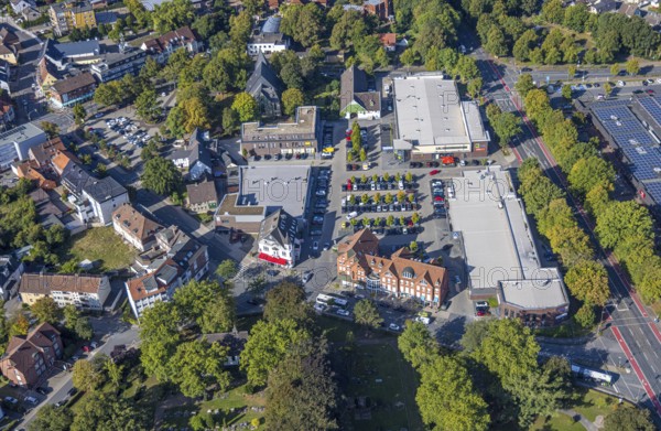 Aerial view, shopping centre Herringen with supermarket DM, Edeka Weber and Aldi, evang. Sankt-Viktor-Kirche, district Herringen, Hamm, Ruhr area, North Rhine-Westphalia, Germany, DE, shopping, shopping centre, shopping place, shopping mall, Europe, aerial view, aerial photography, aerial photography, local supply centre, shopping centre, supermarket, overview, bird's eye view, birds-eyes view, overview