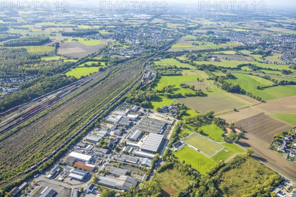 Aerial view, marshalling yard Hamm, industrial area Schieferstraße and view to the residential area district Selmigerheide, meadows and fields Daberg, district Pelkum, Hamm, Ruhr area, North Rhine-Westphalia, Germany, railway area, DE, Deutsche Bahn AG, Europe, commercial enterprise, commercial area, commercial area, commercial property, commercial location, commercial use, railway tracks, tracks, property tax, goods trains, real estate, industrial area, industrial site, aerial view, aerial photography, aerial photography, overview, bird's-eye view, residential area, residential area and living, residential quality, residential neighbourhood, residential estate, residential district, birds-eyes view, overview