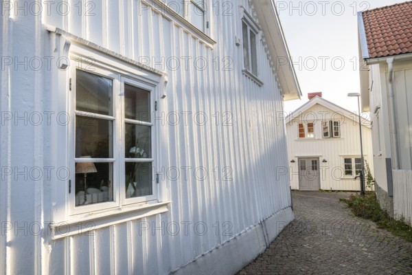 White wooden houses in the alleyways of Smögen, Smögenbryggan, Västra Götalands Län, Bohuslän, Sweden