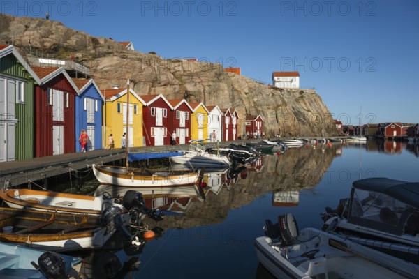 Boats and colourful boathouses in the harbour of Smögen, Smögenbryggan, Västra Götalands Län, Bohuslän, Sweden