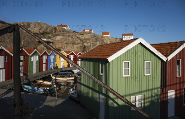 Boats and colourful boathouses in the harbour of Smögen, Smögenbryggan, Västra Götalands Län, Bohuslän, Sweden